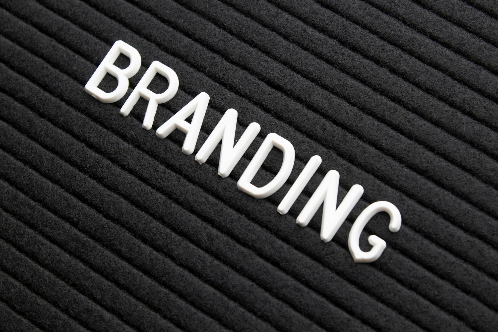 The word branding on black letter board